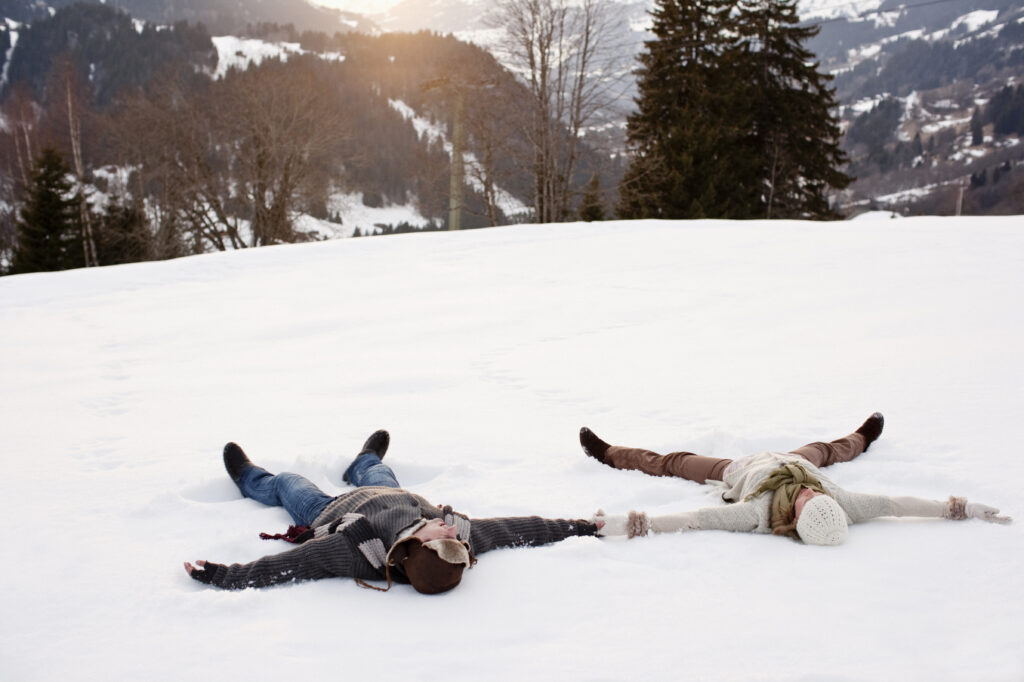 people making snow angels